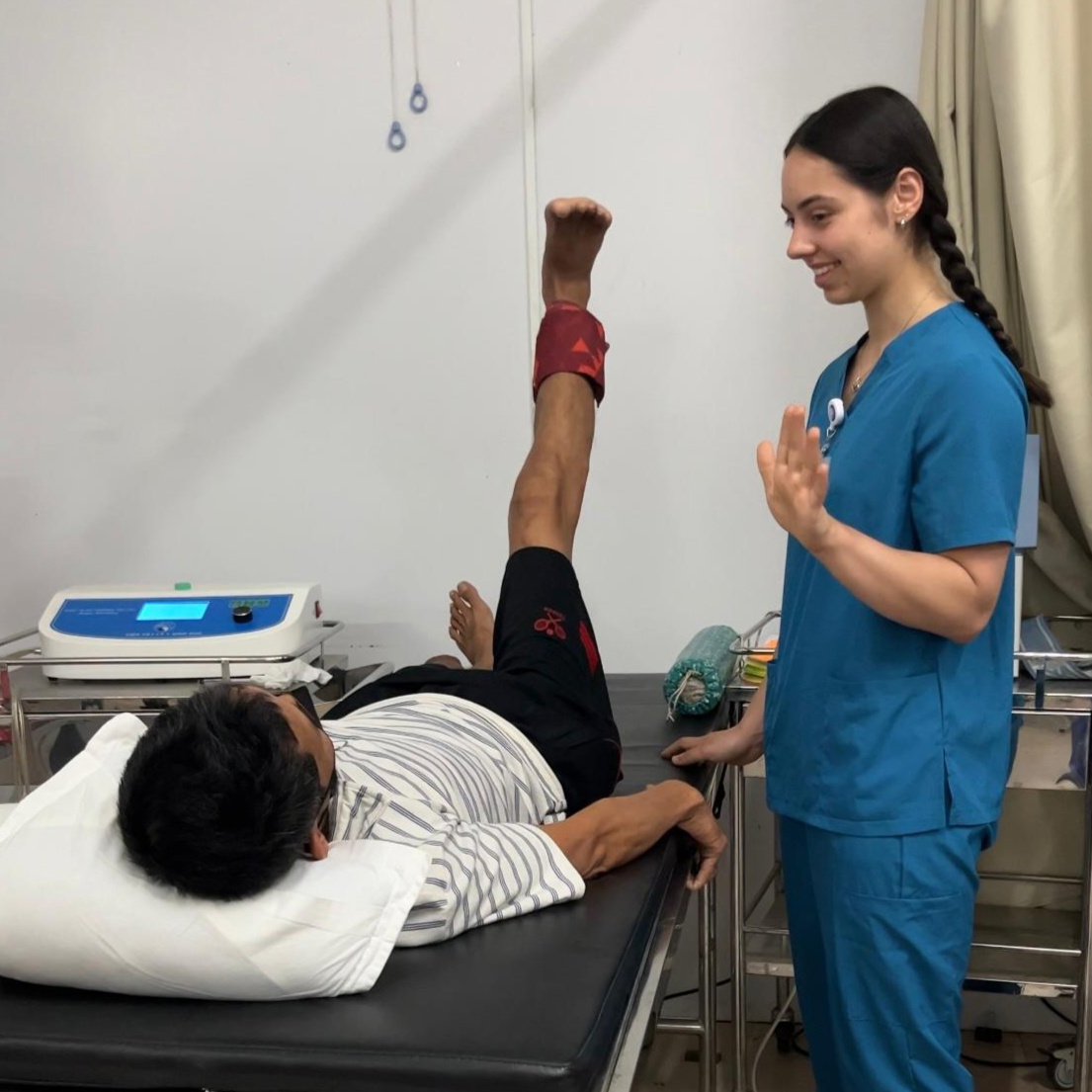 Medical students observing and assisting in surgery in a hospital operating theatre during their elective placement abroad.